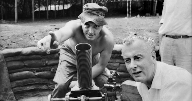 Phuoc Tuy Province, Vietnam. 1966-08. Mortar lesson for the Deputy Leader of the Federal Opposition, Mr Gough Whitlam, as he listens to one of his constituents, Lance Corporal Walter Jenkins of Warwick Farm, Sydney, NSW (left), in the mortar pit at the 5th Battalion, The Royal Australian Regiment (5RAR), during an inspection of 1st Australian Task Force installations. Image credit: Australian War Memorial Collections