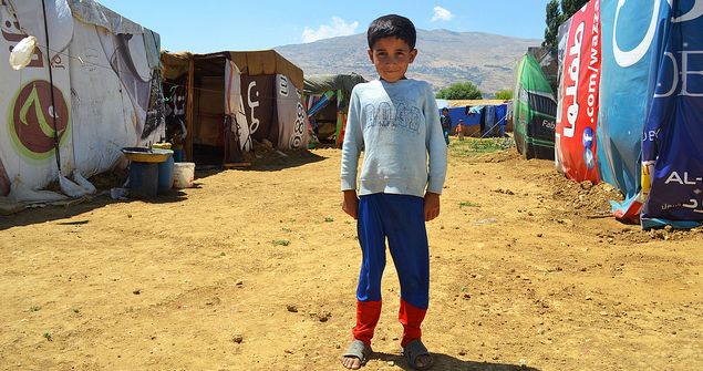 A refugee child in the camp at Qab Elias, Bekaa Valley, Lebanon, near the Syrian border. Image Credit: Flickr (CAFOD Photo Library) Creative Commons.