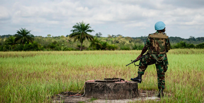 UN Peacekeeper in Liberia standing guard. Photo Credit: Flickr (United Nations Photo) Creative Commons.