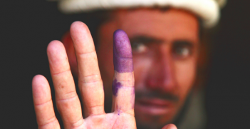 A man votes in Afghanistan  - Democracy is in retreat around the world. Photo Credit: Flickr (US Army Garrison - Miami) Creative Commons.