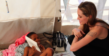Angelina Jolie visits a boy who lost a limb in the Haitian earthquake. Photo Credit: Flickr (UNHCR UN Refugee Agency) Creative Commons.
