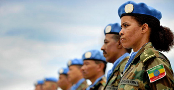 A female member of the Ethiopian battalion of the United Nations Mission in Liberia (UNMIL) joins the military observers in a parade to receive the medals in recognition of their contribution to the mission. Photo Credit: Flickr (UN Photo/Christopher Herwig) Creative Commons