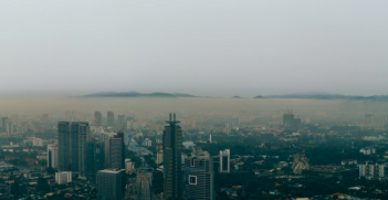 Beautiful and strange, haze chokes the city. Photo Source: Flickr (Naz Amir) Creative Commons