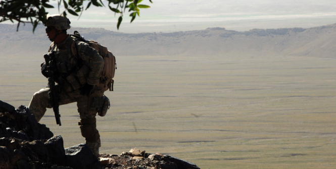 A U.S. Army Soldier from 2nd Battalion, 508th Parachute Infantry Regiment searches the mountains of the Andar province of Afghanistan for Taliban members and weapons caches June 6, 2007. Photo Source: (Flickr) The U.S. Army. Creative Commons.