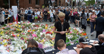 People signing condolences books after Lindt Café siege, Martin Place, Sydney, 2014-12-16. Photo Source: Wikimedia Commons. Creative Commons.