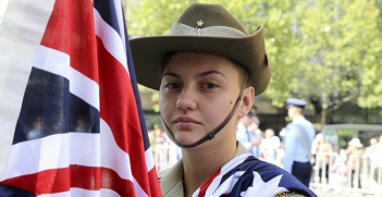 Trainee from Defence Force School of Signals Signalman Payge Condon is one of the flag raiser for the Australia Day Flag Raising Ceremony at Town Hall, Melbourne. Photo Source: Defence Images. 