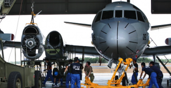 The Royal Australian Air Force and the Japan Maritime Self Defence Force members work together on an engine in Darwin. Photo source: Australian Department of Defence (Flickr). Creative Commons. 