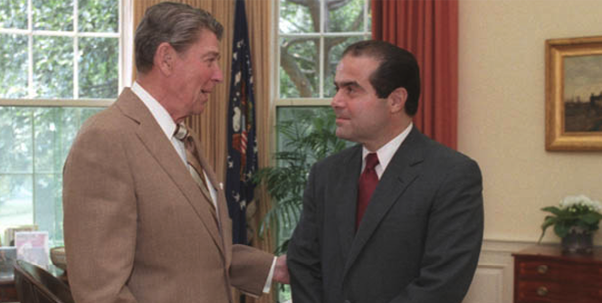President Ronald Reagan and Judge Antonin Scalia confer in the Oval Office, July 7, 1986. Photo source: Bill Fitz-Patrick (Flickr). Creative Commons. President Ronald Reagan and Judge Antonin Scalia confer in the Oval Office, July 7, 1986. Photo source: Bill Fitz-Patrick (Flickr). Creative Commons.