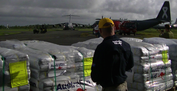 Australian aid humanitarian supplies being loaded up. Photo source: DFAT (Flickr). Creative Commons. 