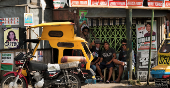 Pedicab waiting station surrounded by election material in Silay City, Philippines. Photo source: Brian Evans (Flickr). Creative Commons.