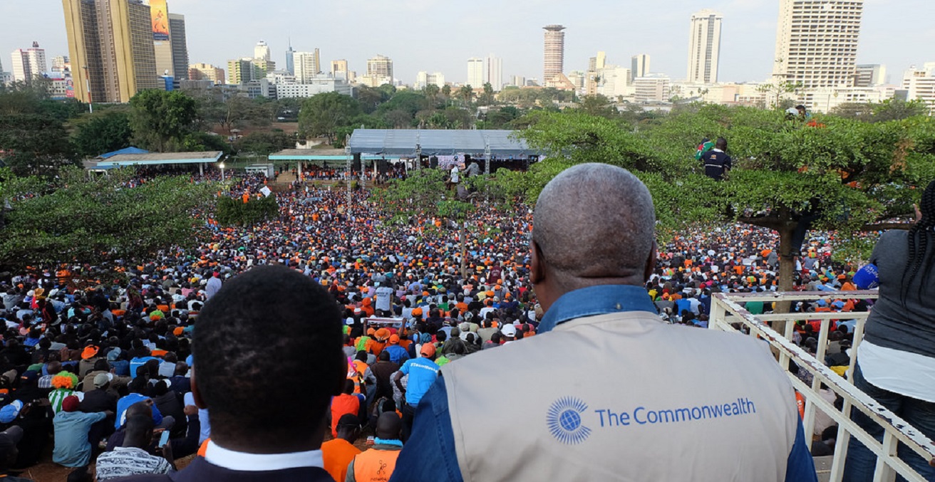 An international observer looks over a crowd gathered for the 2017 Kenya election.