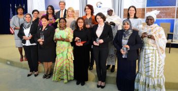 Former US Secretary of State John Kerry with the winners of the 2015 Women of Courage