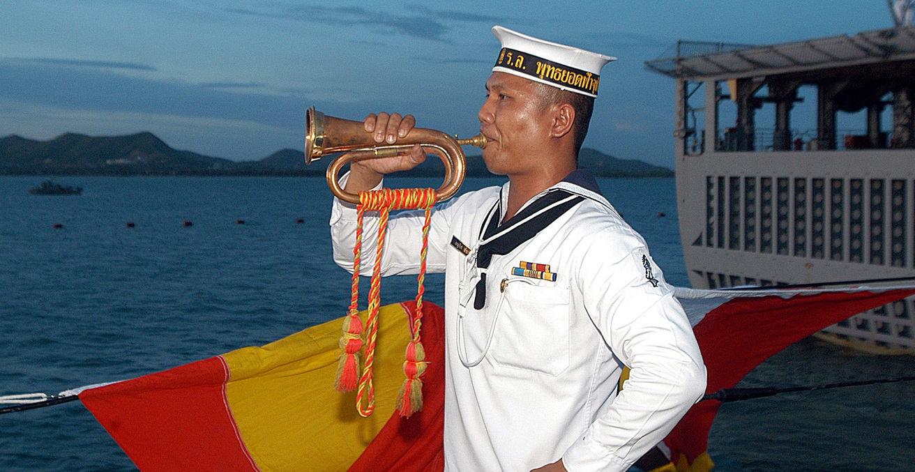 A Royal Thai Navy bugler aboard HTMS Phutthayotfa Chulalok 