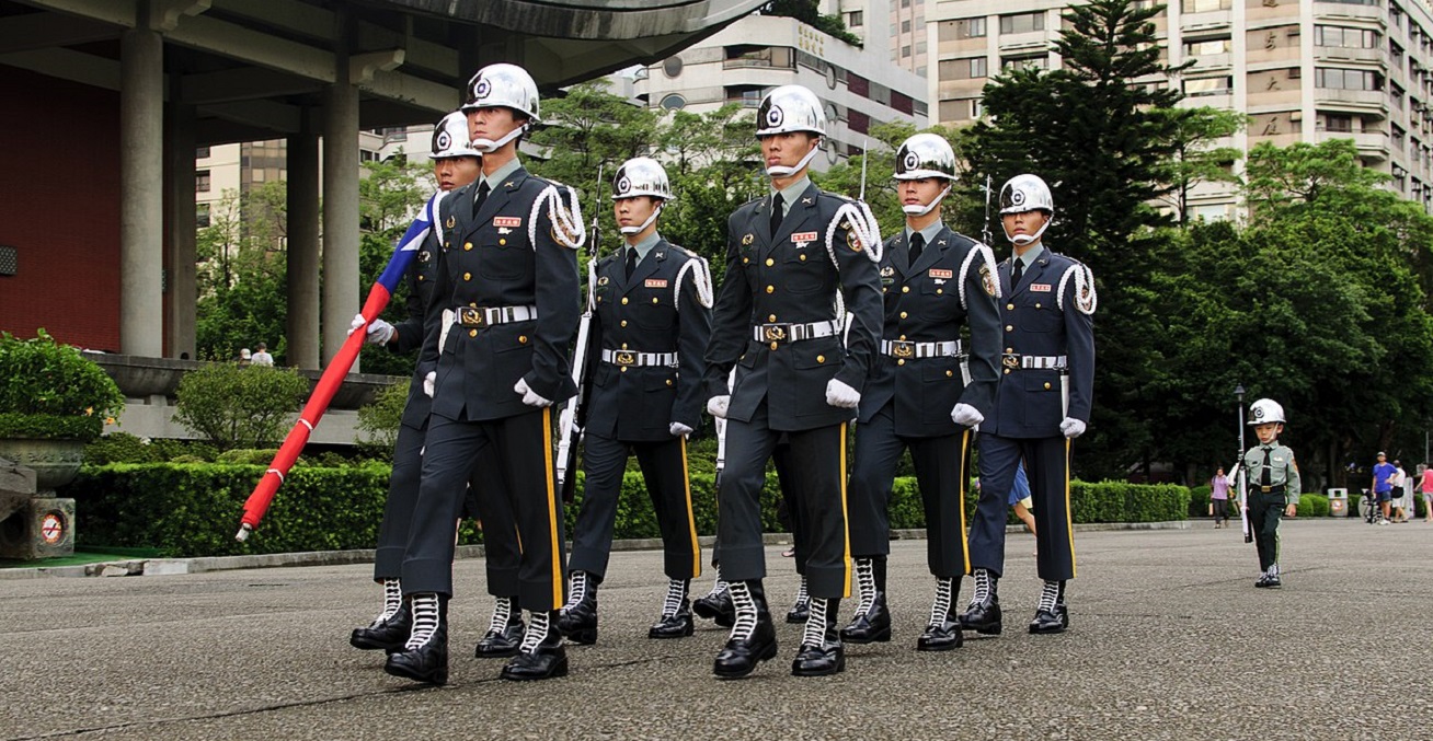Taiwanese soldiers are joined by a child