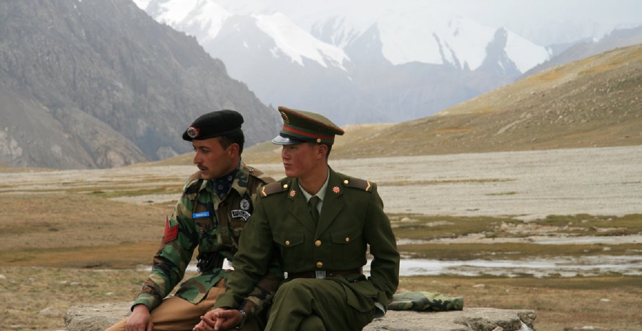 Chinese and Pakistani border guards overlook the remote Khunjerab Pass which connects the two countries