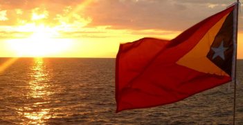 Timorese Flag At Sunset over the Timor Sea
