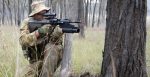 An Australian army soldier returns fire during an exercise. 
