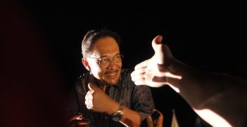 Malaysian opposition leader Anwar Ibrahim greets his supporters during a rally dressed in mourning black gathered to denounce elections which they claim were stolen through fraud by the coalition that has ruled for 56 years. in Penang May 11 2013. Pix Firdaus Latif