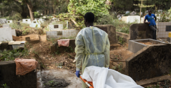 The Red Cross at the cemetery in Conakry, Guinea, in 2015 undertaking the safe and dignified burial of a 40-year-old woman who died from Ebola. Source: Martine Perret, UNMEER on Flickr  