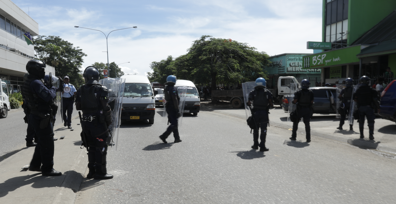 Solomon Islands police close the main road in the central business district of Honiara. Photo: Sukwadi Media