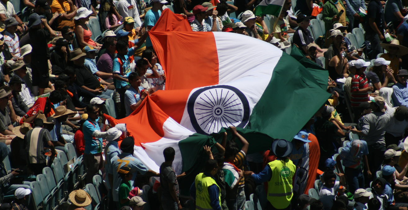 India cricket fans with an Indian flag. Source: Wikimedia Commons http://bit.ly/2MUzfP9