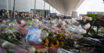 The sea of flowers at the airport for the victims of the disaster of Flight MH17. Source: Wikimedia Commons - Jurgen NL