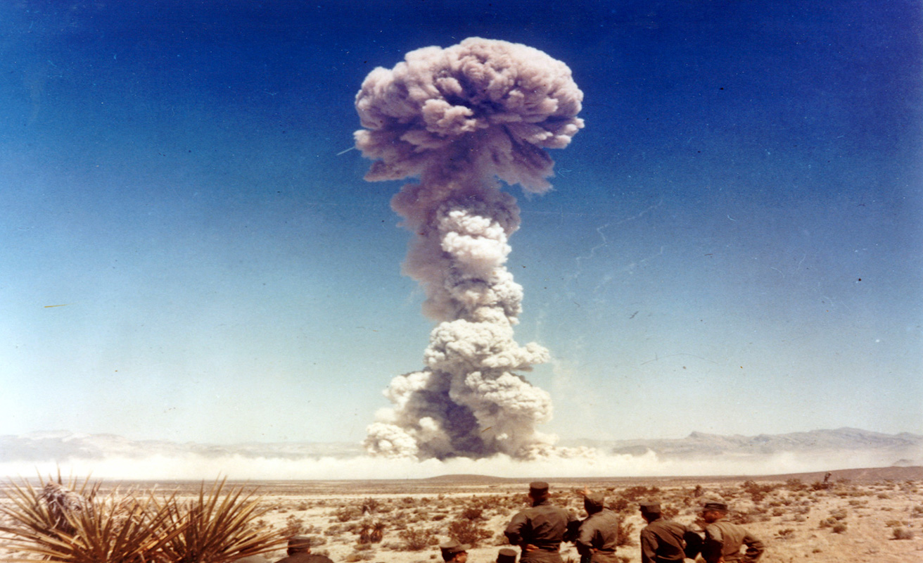 Military personnel observe a nuclear weapons test in Nevada, Source: International Campaign to Abolish Nuclear Weapons, Flickr, https://bit.ly/2ZfaNcp