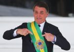 Brazil's President Jair Bolsonaro gestures after receiving the presidential sash, Source: Sergio Moraes, Flickr, https://bit.ly/2kv1Ih0