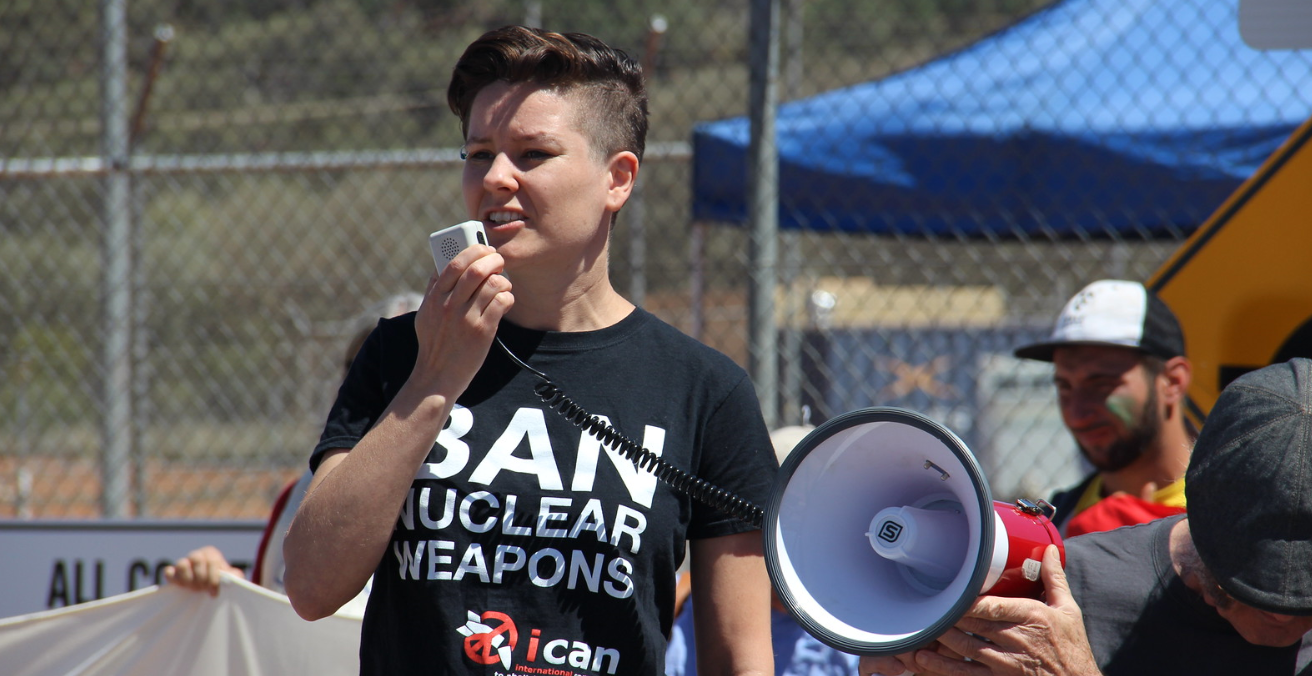 ICAN campaigner Ray Acheson of the Women's International League for Peace and Freedom speaks at a protest against the main US military base in Australia, Pine Gap, which is involved in nuclear targeting. Source: Tim Wright https://bit.ly/3cC99cN