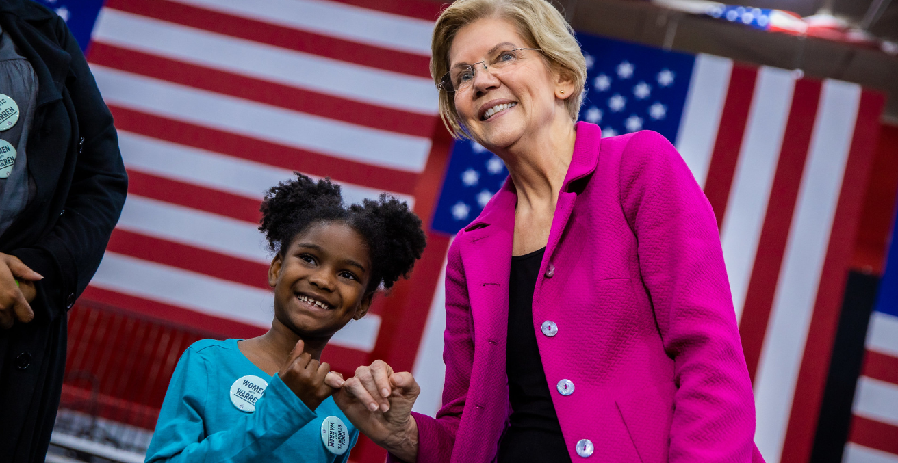 Senator Elizabeth Warren makes a pinkie promise with a young girl at a rally at Clark Atlanta University in Atlanta, GA on Thursday, November 21st, 2019. Source: Elizabeth Warren https://bit.ly/3d4nZsK