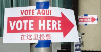 Voting signs in Spanish, English, and Chinese show the way to the polling station.  Source: Tim Brown https://bit.ly/34H2wSR