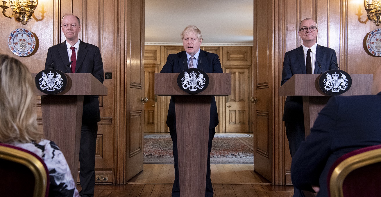 Britain's Prime Minister Boris Johnson (middle) during a press conference on the Coronavirus with Chief Medical Officer for England Chris Whitty (left), and Chief Scientific Adviser Patrick Vallance (right) inside No10 Downing Street. Source: Stephen Harvey/No10 Downing Street https://bit.ly/2X0l1jb