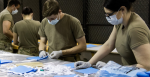 Parachute riggers with 1st Special Forces Group (Airborne), Group Support Battalion, sew surgical masks for medical patients at Joint Base Lewis-McChord, Wash., March 31, 2020. Source: Joe Parrish https://bit.ly/2UJw92k