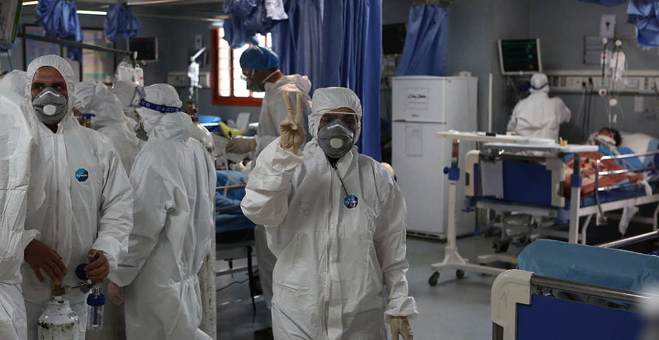 Workers in protective equipment at the emergency department of Masih Daneshvari Hospital, which has been evacuated of coronary heart disease patients since the beginning of March to care for coronavirus patients. Source: Mohsen Abolghasem https://bit.ly/2WdNGAL