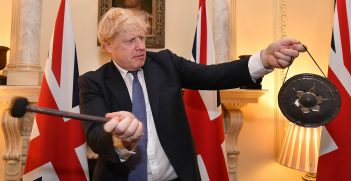 Britain's Prime Minister Boris Johnson inside No10 Downing street striking a gong at 11pm the moment the UK left the EU. Source: Andrew Parsons/No10 Downing Street https://bit.ly/2YynVuF