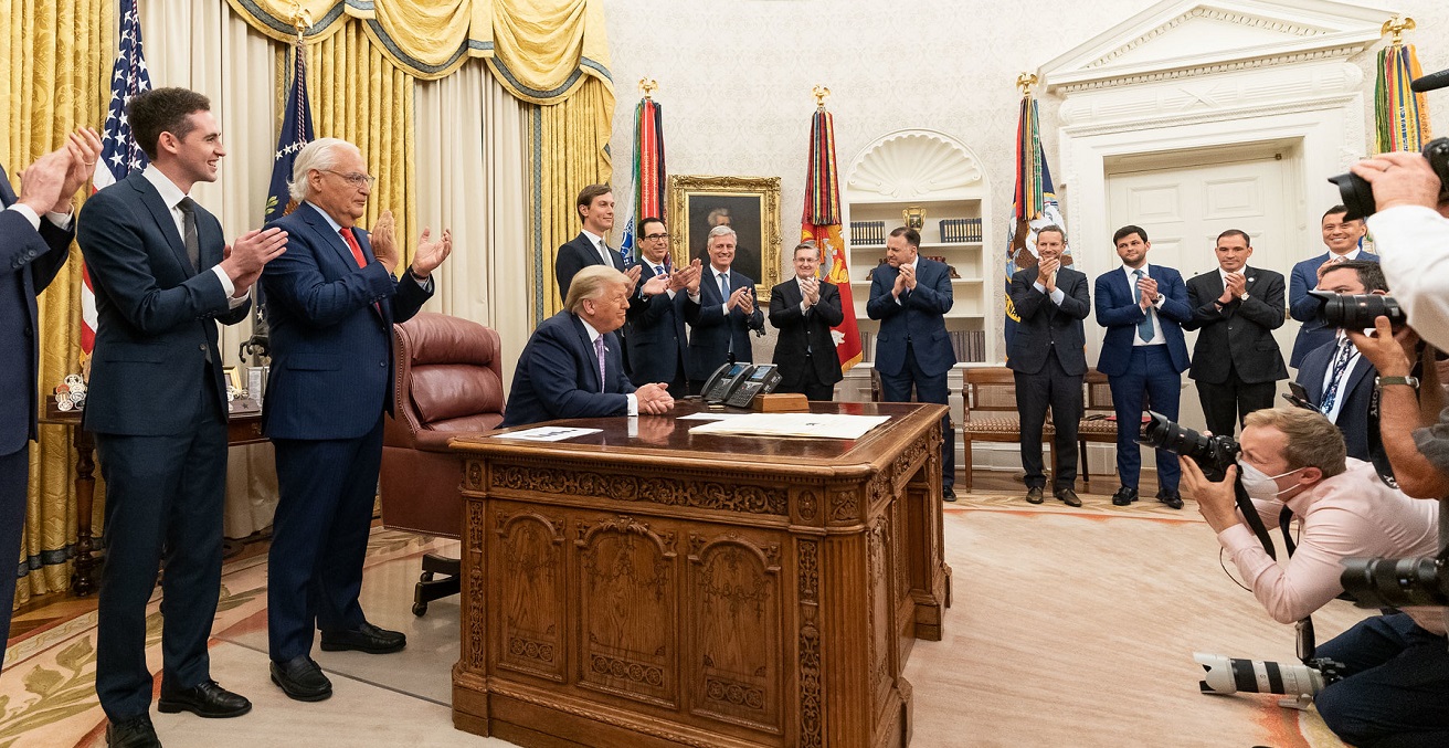 President Donald J. Trump, joined by White House senior staff members, delivers a statement announcing the agreement of full normalization of relations between Israel and the United Arab Emirates Thursday, Aug. 13, 2020, in the Oval Office of the White House. Source: Official White House Photo/Joyce N. Boghosian https://bit.ly/2CJYhfC