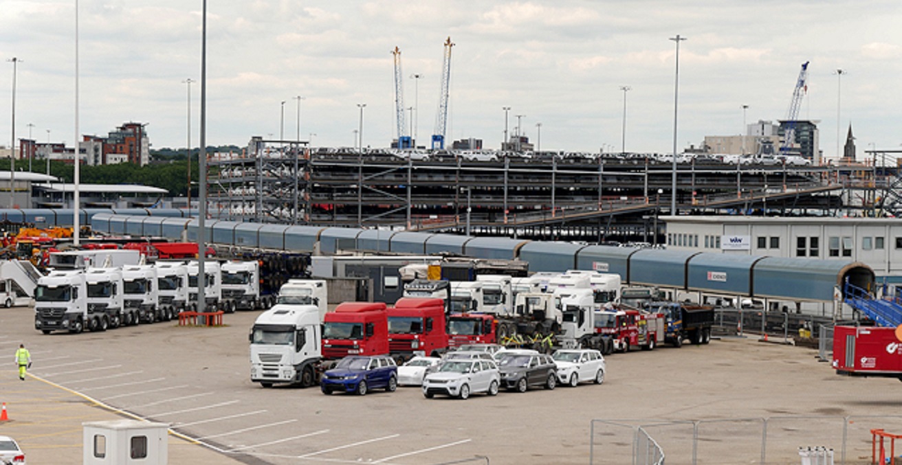 The vehicles on the quayside are waiting to be loaded onto SU4209 : Höegh America Loading Vehicles at Southampton Docks. The train behind the wharf is also full of left-hand drive cars and one of the multi-storey holding compounds can be seen behind the train.
Source: David Dixon, https://bit.ly/3lpuee0