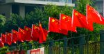 A row of Chinese flags on a fence. Source: Chris https://bit.ly/3aSUpXP