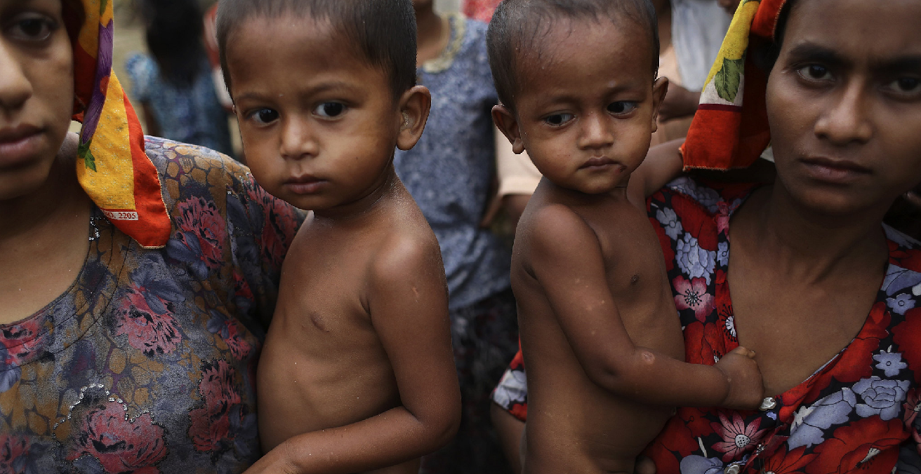 Rohingya women hold their children at the Khaung Dokkha camp for internally displaced people in Sittwe, Rakhine state, April 22, 2014. Source: trust.org https://bit.ly/3cgkfV9