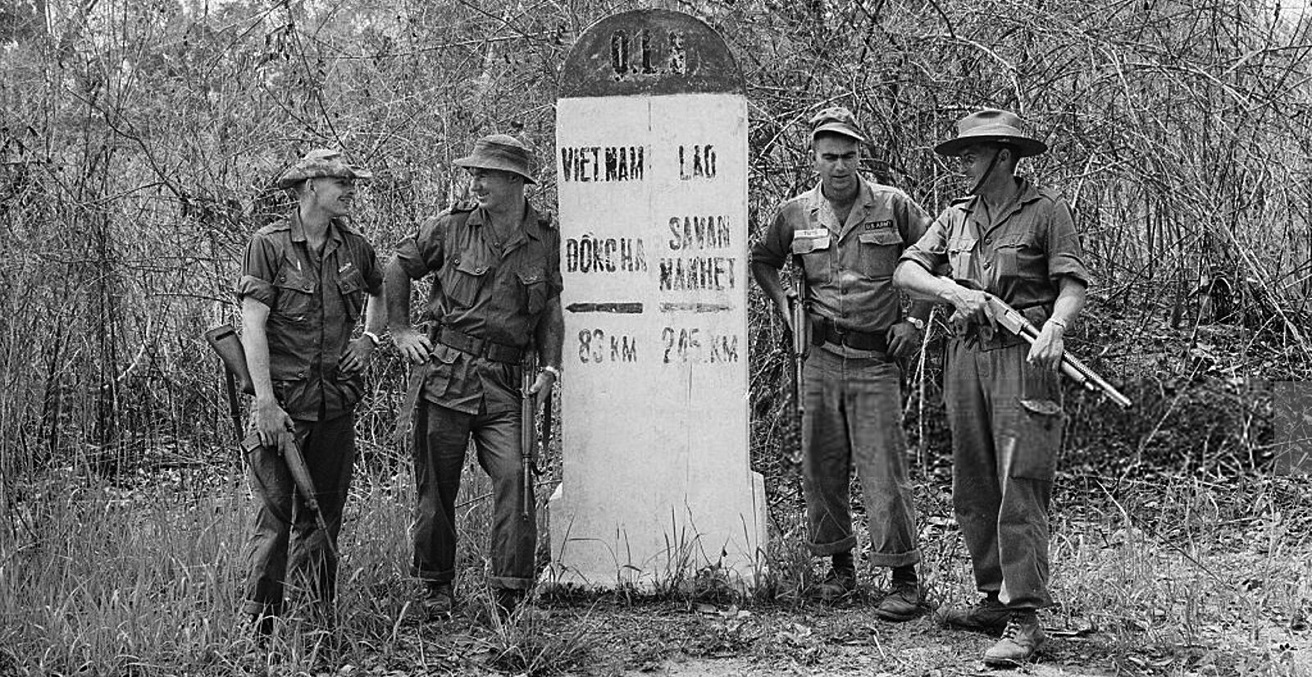 An Australian-American patrol rests at the marker on the Laos-South Vietnam border, 1965. Source: manhhai https://bit.ly/2WBSGl4