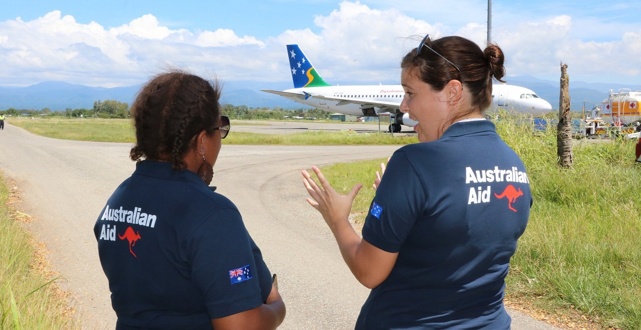 Staff from the Australian High Commission in Honiara greet the arrival of an Australian funded COVID-19 support package. Source: DFAT https://bit.ly/2VtbjYj 