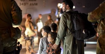 Afghan father and children evacuees leave a U.S. C-17 Globemaster after arriving to Ali Al Salem Air Base, Kuwait, August 24, 2021. The Department of Defense is committed to supporting the evacuation of American citizens, Special Immigrant Visa applicants and other at-risk individuals from Afghanistan. (U.S. Air Force photo by Staff Sgt. Ryan Brooks)