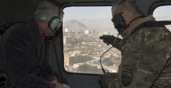 U.S. Army Gen. John F. Campbell, commander of the International Security Assistance Force and U.S. Forces-Afghanistan highlights some of the countryside to Secretary of Defense Chuck Hagel, as they fly to Forward Operating Base Gamberi to visit service members, Dec. 7, 2014. (Photo by Master Sgt. Adrian Cadiz/Released)