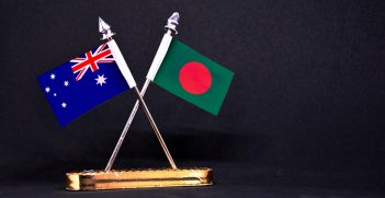 Australia and Bangladesh table flag with black Background. Source: Aritra Deb/Shutterstock