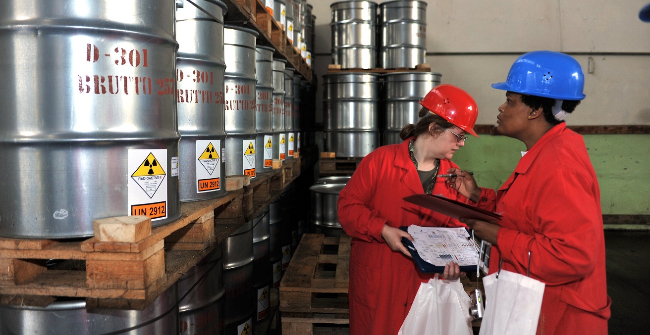 Inspectors check the barrels which are ready to be shipped abroad. Only countries that have an Additional Protocol are required to declare their yellowcake stockpiles to the IAEA. Source: Dean Calma / IAEA https://bit.ly/3Bms1Y8