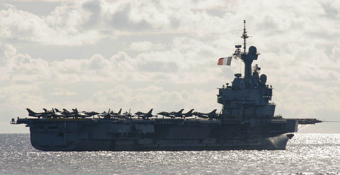 French Navy aircraft carrier, FS Charles de Gaulle (R 91) sails in formation during exercises La Perouse. The exercise, comprised of multiple anti-submarine warfare drills, was designed to enhance unit-level training, improve the strike group’s ability to respond to a submarine threat, and enhance interoperability between the Quad and French navies. (U.S. Navy photo by Mass Communication Specialist 1st Class Leonard Adams)