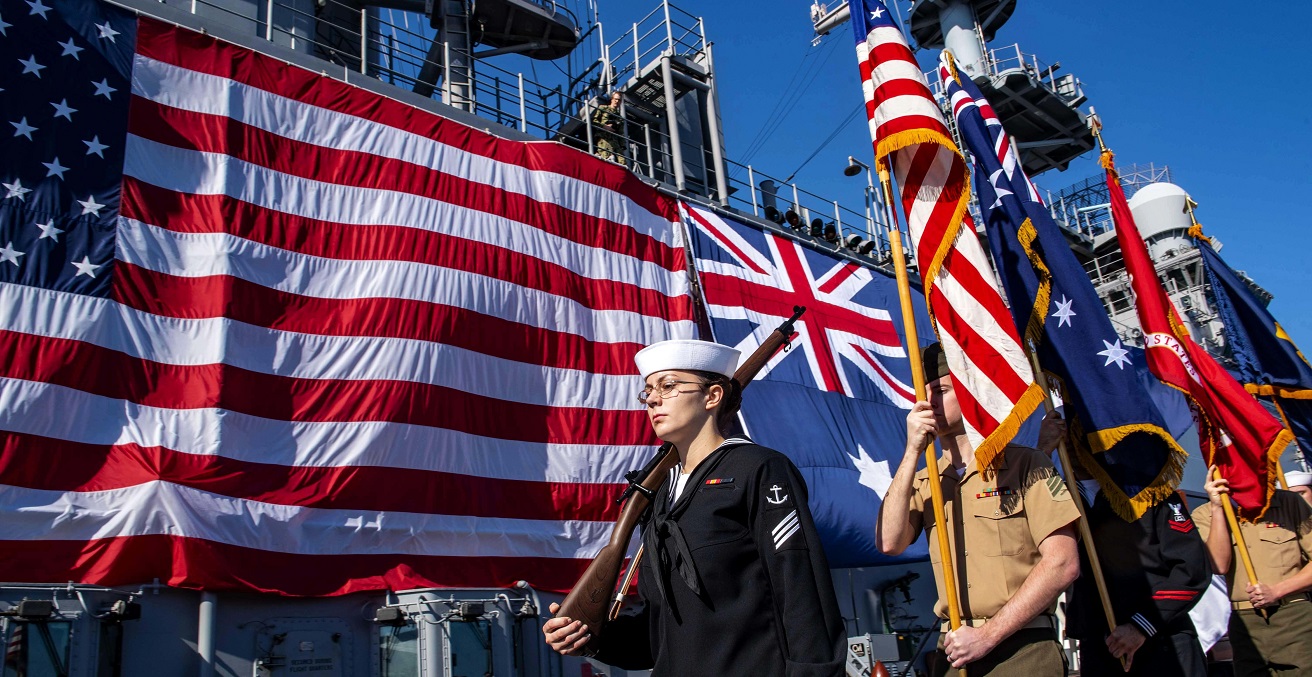 The color guard parades the colors during the closing ceremony of the eighth U.S. and Australian exercise Talisman Sabre 2019 held aboard the amphibious assault ship USS Wasp (LHD 1). Wasp Expeditionary Strike Group, with embarked 31st Marine Expeditionary Unit, just concluded exercise Talisman Sabre 2019 off the coast of Northern Australia. A bilateral, biennial event Talisman Sabre is designed to improve U.S. and Australian combat training, readiness and interoperability through realistic, relevant training necessary to maintain regional security, peace and stability. (U.S. Navy photo by Mass Communication Specialist Seaman Apprentice David Glotzbach)