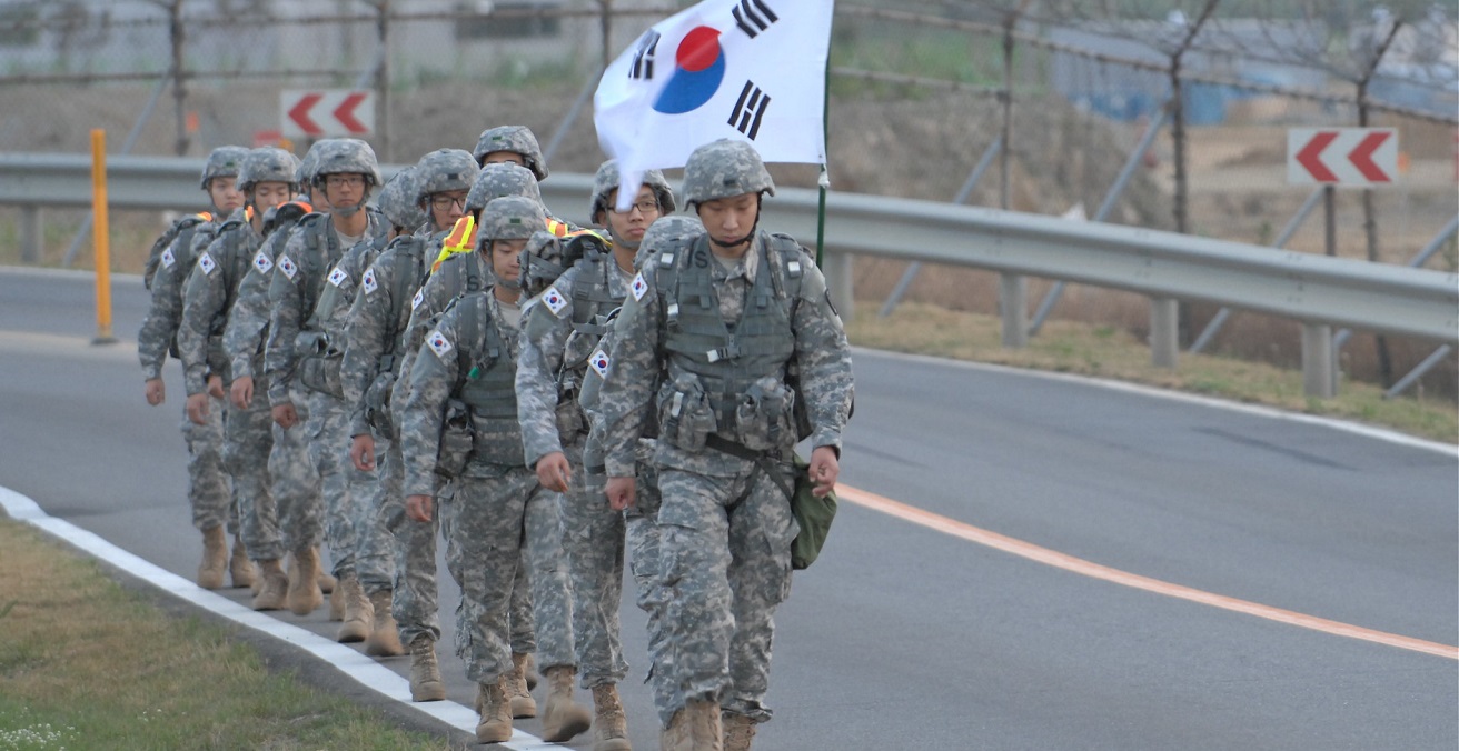 Republic of Korea Army officers joined Korean Augmentation to the United States Army Soldiers (KATUSAs) for a rucksack march in commemoration of the 62nd anniversary of the Korean War. Source: U.S. Army photos by Cpl. Han, Jae Ho https://bit.ly/3Amr81e