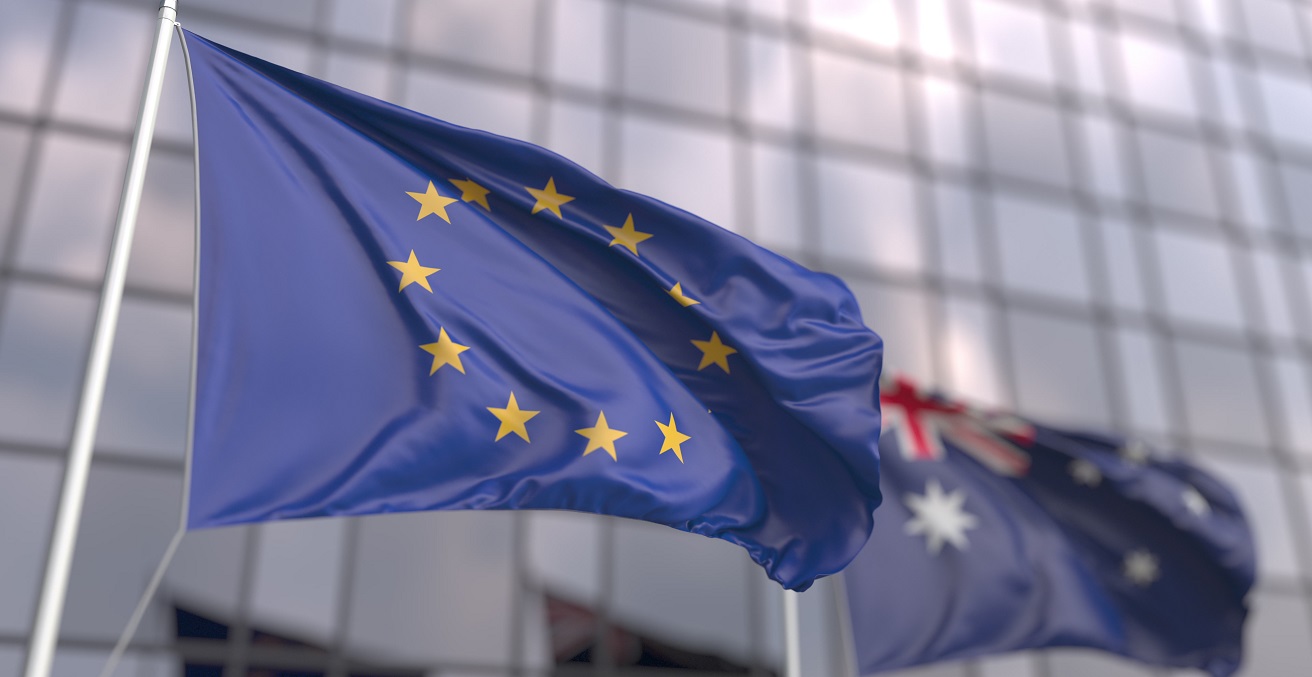 Waving flags of the EU and Australia near modern skyscraper. Source: Novikov Aleksey/Shutterstock