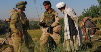 Mentoring and Reconstruction Task Force 2 (MRTF-2) engineer Captain Rodney Davis (left) and interpreter Micheal (right), stop during a patrol to speak to local nationals in Sorkh Lez in 2009. Source: Resolute Support Media, Flickr,  https://bit.ly/3weofkX